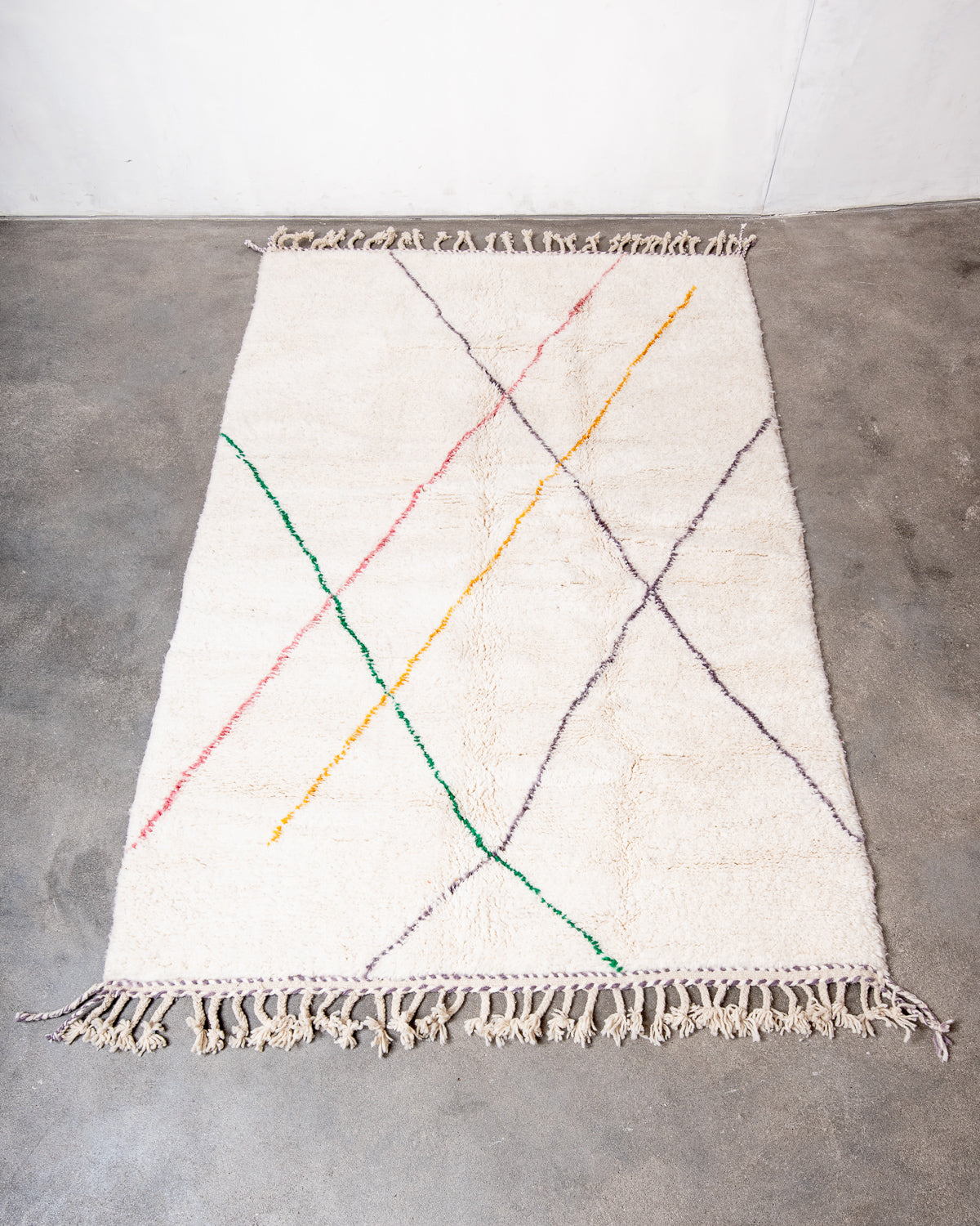 Modern, designer, handcrafted Berber rug from Morocco. Beniourain carpet with beautiful colours and patterns and fluffy wool texture.